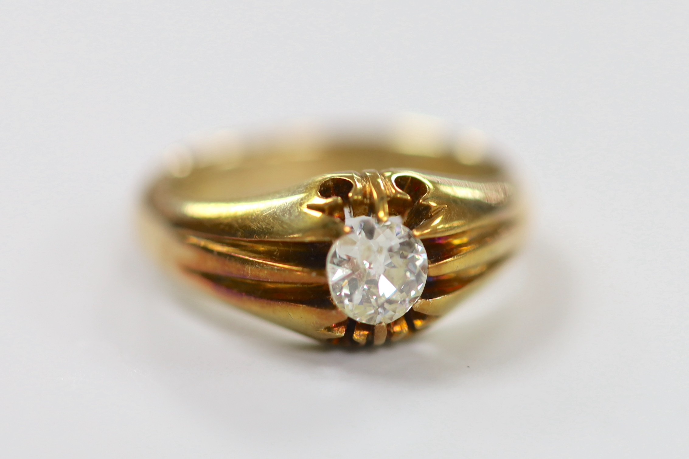 An early 20th century 18ct and claw set solitaire diamond ring, size P, gross weight 7.2 grams